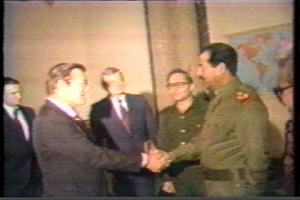 Donald Rumsfeld shakes hands with Saddam Hussein - 19831220