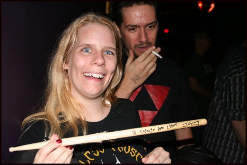 Clint & Carolyn with autographed drumstick by NoMeansNo